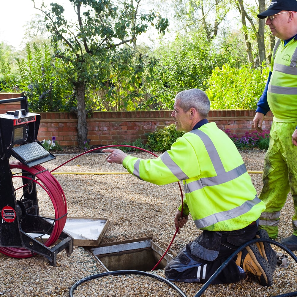 Snaking a high pressure water jet to clear sewer blockages