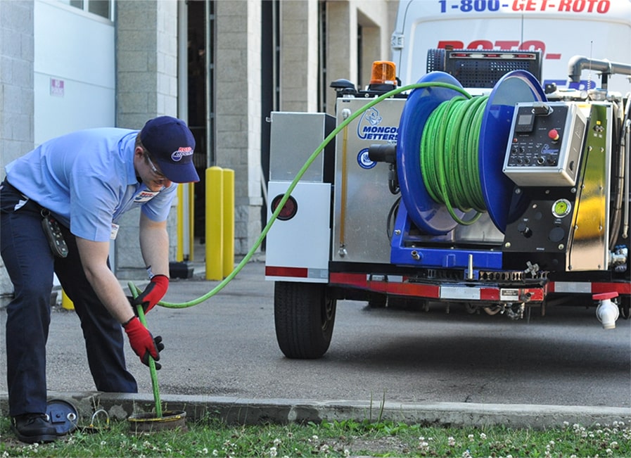 Clear drains clogged by storm debris & roots near Milwaukee