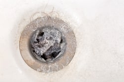 Soap scum clogging drain pipes